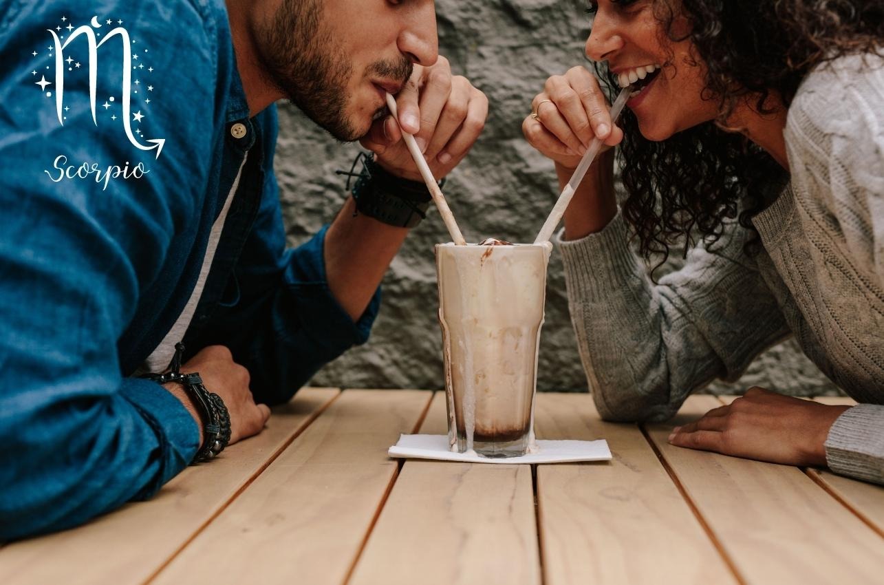 Scorpio woman drinking milkshake with man